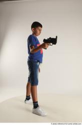 TIMBO STANDING POSE WITH GUN